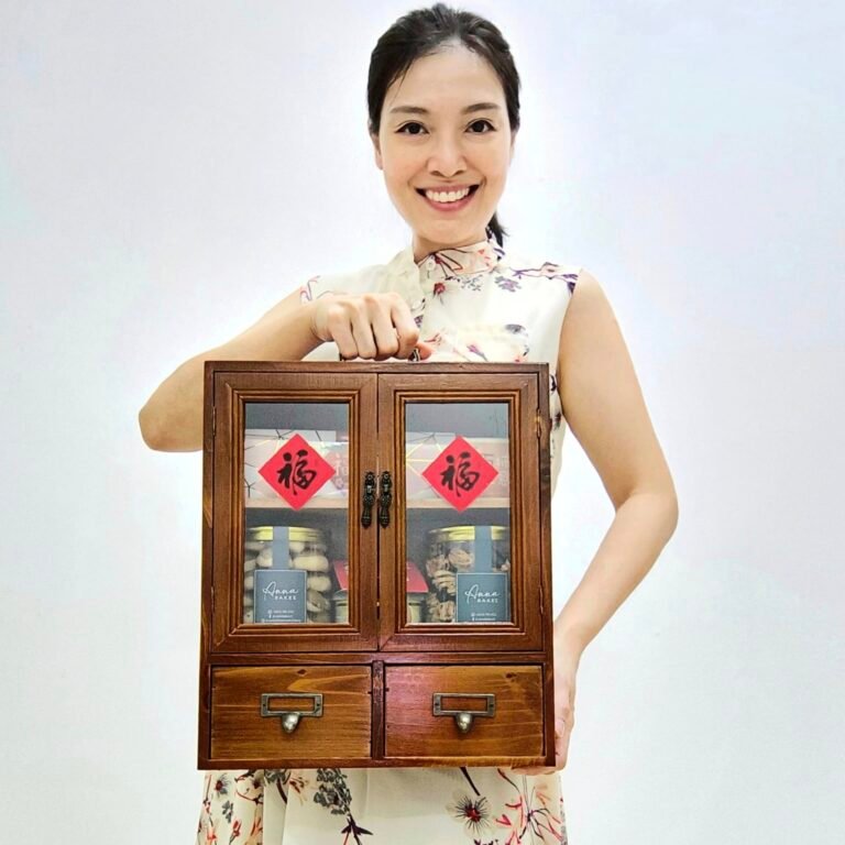 Anna holding Fu Gui Cupboard